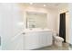 This bathroom features a double sink vanity and shower at 6677 Sw 81St Loop, Ocala, FL 34476