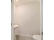 Well-lit powder room with pedestal sink and tiled flooring at 6677 Sw 81St Loop, Ocala, FL 34476