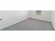 This bedroom features neutral carpet and trim at 6677 Sw 81St Loop, Ocala, FL 34476