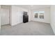 Bright bedroom featuring neutral carpeting and ample natural light at 6677 Sw 81St Loop, Ocala, FL 34476