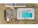 Overhead view of a community pool with an adjacent pavilion and lounge chairs at 6677 Sw 81St Loop, Ocala, FL 34476
