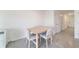 Dining area shows neutral colors and a table with 4 chairs near the entryway at 6677 Sw 81St Loop, Ocala, FL 34476