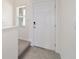 Tiled foyer with a view of the staircase and the front door at 6677 Sw 81St Loop, Ocala, FL 34476