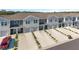Beautifully constructed townhomes, each featuring attached garages and long driveways at 6677 Sw 81St Loop, Ocala, FL 34476