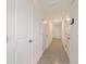 Hallway with tile flooring and multiple doors at 6677 Sw 81St Loop, Ocala, FL 34476