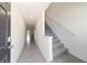 Hallway with stairs and view of kitchen at 6677 Sw 81St Loop, Ocala, FL 34476