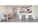 Open-concept living area showcasing a modern kitchen with an island and dining space at 6677 Sw 81St Loop, Ocala, FL 34476