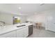Bright, eat-in kitchen featuring stainless steel appliances and white cabinets at 6677 Sw 81St Loop, Ocala, FL 34476