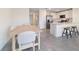 Modern kitchen features white cabinetry, stainless appliances, open to a dining area at 6677 Sw 81St Loop, Ocala, FL 34476