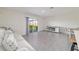 A bright, open living room with sliding glass doors and stylish neutral decor at 6677 Sw 81St Loop, Ocala, FL 34476