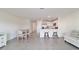 Expansive living space with tiled floors, leading to the kitchen, dining, and outdoor access at 6677 Sw 81St Loop, Ocala, FL 34476