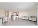 Spacious living area connects to a modern kitchen, complete with dining space and a seating area at 6677 Sw 81St Loop, Ocala, FL 34476