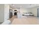 View of an open concept layout featuring a kitchen with stainless steel appliances and a living area at 6677 Sw 81St Loop, Ocala, FL 34476