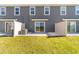 Sliding glass doors open onto a private patio area with an adjacent white privacy fence at 6677 Sw 81St Loop, Ocala, FL 34476