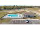 A stunning community pool with ample lounging space and a convenient pool house at 6677 Sw 81St Loop, Ocala, FL 34476