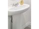 Close up of a white bathroom sink with tile floor at 6677 Sw 81St Loop, Ocala, FL 34476