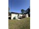 Exterior view of a home with a deck in the backyard at 574 E Normandy Blvd, Deltona, FL 32725