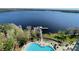 Breathtaking aerial view of a lakefront community featuring a pool and pier at 13415 Blue Heron Beach Dr # 1407, Orlando, FL 32821