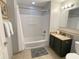 Well-maintained bathroom featuring a shower-tub combo, vanity, and toilet at 13415 Blue Heron Beach Dr # 1407, Orlando, FL 32821