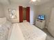Relaxing bedroom with a comfortable bed, TV on a dresser, artwork, and a neutral color scheme at 13415 Blue Heron Beach Dr # 1407, Orlando, FL 32821