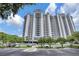Elegant condominium building with multiple balconies, offering stunning views and ample parking at 13415 Blue Heron Beach Dr # 1407, Orlando, FL 32821