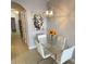 Elegant dining room with a glass table and modern chandelier at 13415 Blue Heron Beach Dr # 1407, Orlando, FL 32821