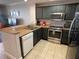 Well-equipped kitchen with stainless steel appliances and a breakfast bar at 13415 Blue Heron Beach Dr # 1407, Orlando, FL 32821