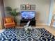 Comfortable living room with modern decor, a large TV, and a view of the kitchen at 13415 Blue Heron Beach Dr # 1407, Orlando, FL 32821