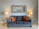 Stylish living room with a comfortable gray sofa and elegant decor at 13415 Blue Heron Beach Dr # 1407, Orlando, FL 32821