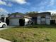Charming single-story home featuring a two-car garage and a well-maintained lawn in a Gathering-friendly neighborhood at 636 Birgham Pl, Lake Mary, FL 32746