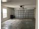 Spacious garage featuring a large window for natural light and an automatic door for convenience at 636 Birgham Pl, Lake Mary, FL 32746