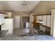 Bright kitchen featuring white cabinetry, granite countertops, and a convenient laundry area with modern appliances at 636 Birgham Pl, Lake Mary, FL 32746