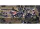 Aerial view of the property showcasing the house, pool, and extensive wooded lot with defined property lines at 9233 Tom Moore Rd, Lakeland, FL 33810