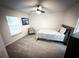Bright bedroom featuring carpet flooring, a ceiling fan, and a window at 9233 Tom Moore Rd, Lakeland, FL 33810