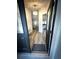 View from open front door into entryway with stairs, leading to living room and kitchen at 9233 Tom Moore Rd, Lakeland, FL 33810