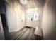 Entryway with tile flooring, white wainscoting, and view of front doors with glass inserts at 9233 Tom Moore Rd, Lakeland, FL 33810