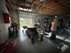 Spacious garage with work-out equipment and lots of workspace at 9233 Tom Moore Rd, Lakeland, FL 33810