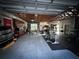 Spacious garage with work-out equipment and lots of storage cabinets at 9233 Tom Moore Rd, Lakeland, FL 33810
