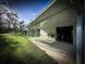 Exterior view of garage with workout area, utility sink and awning at 9233 Tom Moore Rd, Lakeland, FL 33810