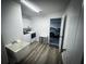 Laundry room with white cabinetry and a sink at 9233 Tom Moore Rd, Lakeland, FL 33810