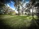 Expansive well-maintained lawn and mature trees at 9233 Tom Moore Rd, Lakeland, FL 33810