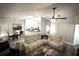 Living room featuring a sectional sofa, ceiling fan, and adjacent kitchen and dining areas at 9233 Tom Moore Rd, Lakeland, FL 33810
