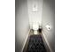 Small powder room with toilet, decorative rug, and decor at 9233 Tom Moore Rd, Lakeland, FL 33810
