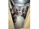 Organized walk-in closet with shelves and hanging space for optimal storage at 9233 Tom Moore Rd, Lakeland, FL 33810