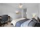 Cozy bedroom features a ceiling fan, desk, and soft lighting, creating a relaxing and functional space at 6121 Metrowest Blvd # 103, Orlando, FL 32835