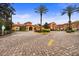 Upscale community features mature trees and lush landscaping and brick-paved road at 6121 Metrowest Blvd # 103, Orlando, FL 32835