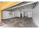 Spacious two-car garage with room for storage, electrical box, and water heater at 6121 Metrowest Blvd # 103, Orlando, FL 32835