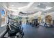 Well-equipped fitness center with modern exercise equipment and ample natural light at 6121 Metrowest Blvd # 103, Orlando, FL 32835