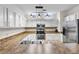 Bright kitchen featuring stainless steel appliances, granite countertops, updated fixtures, and ample storage space at 6121 Metrowest Blvd # 103, Orlando, FL 32835