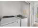 Efficient laundry room with modern washer and dryer, maximizing convenience at 6121 Metrowest Blvd # 103, Orlando, FL 32835